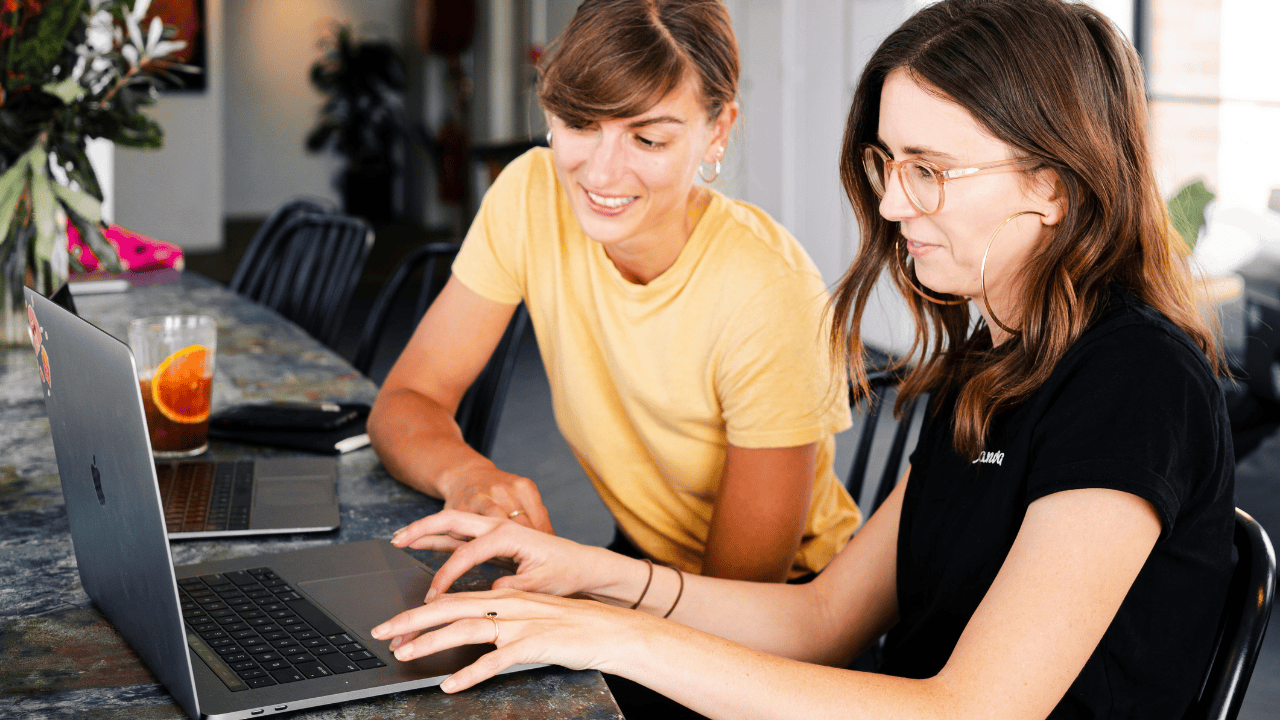women working on laptops