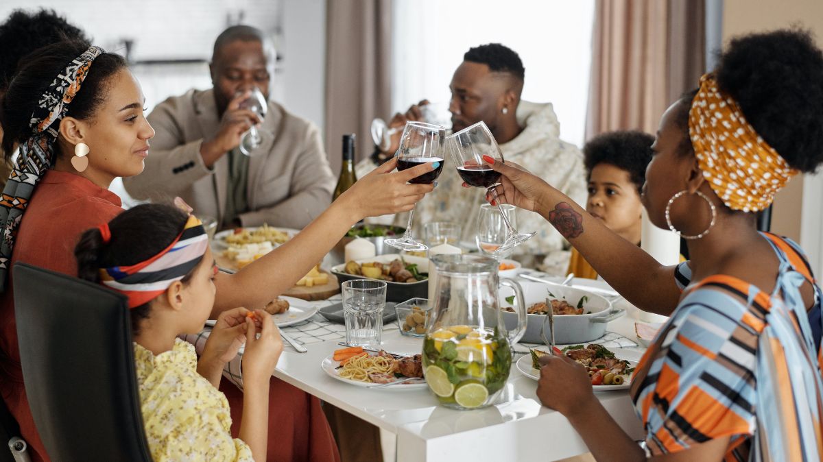 Family having dinner with red wine