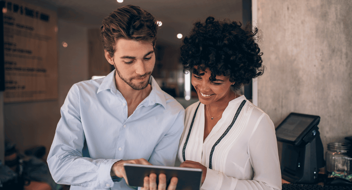 Man and woman looking at tablet